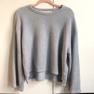 Sweater. Bell sleeves. Longer in the back. Size medium.
